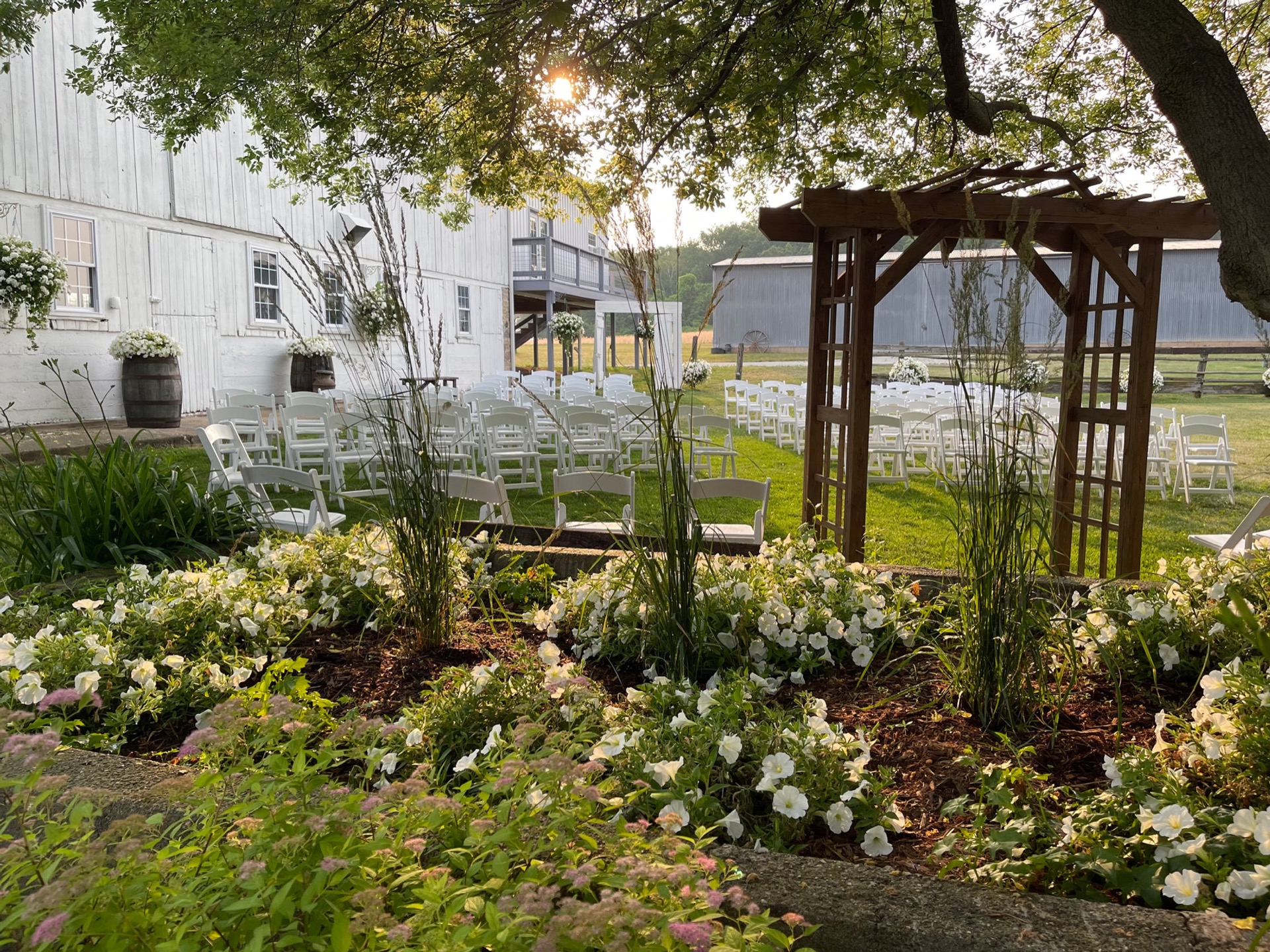Aerial view of Huser Farm wedding barn and countryside at sunset in Princeton, Wisconsin